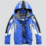Parka ski homme imperméable et épaisse, à capuche bleu sur fond gris